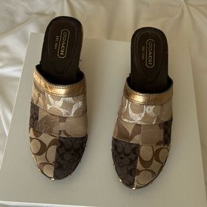 Coach Patchwork Clog with metallic accents.